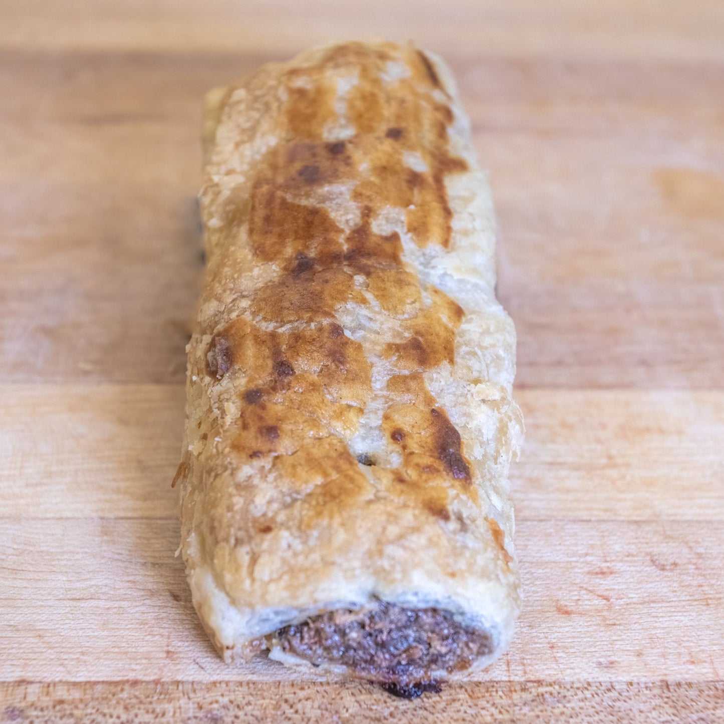 JK Bakery sausage roll with spices wrapped in pastry