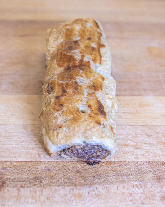 sausage with spices wrapped in pastry