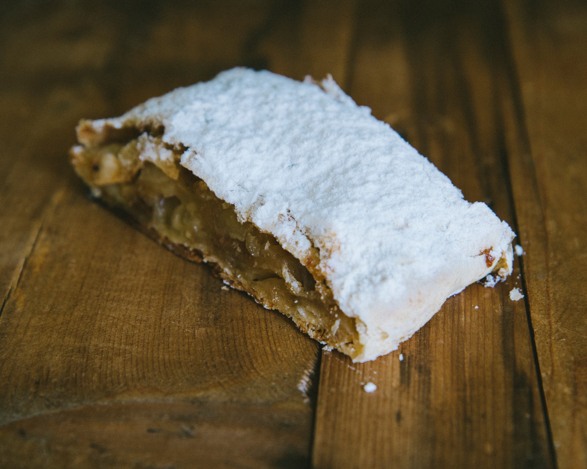 Apples, raisins with a touch of rum wrapped in flaky pastry and dusted with icing sugar